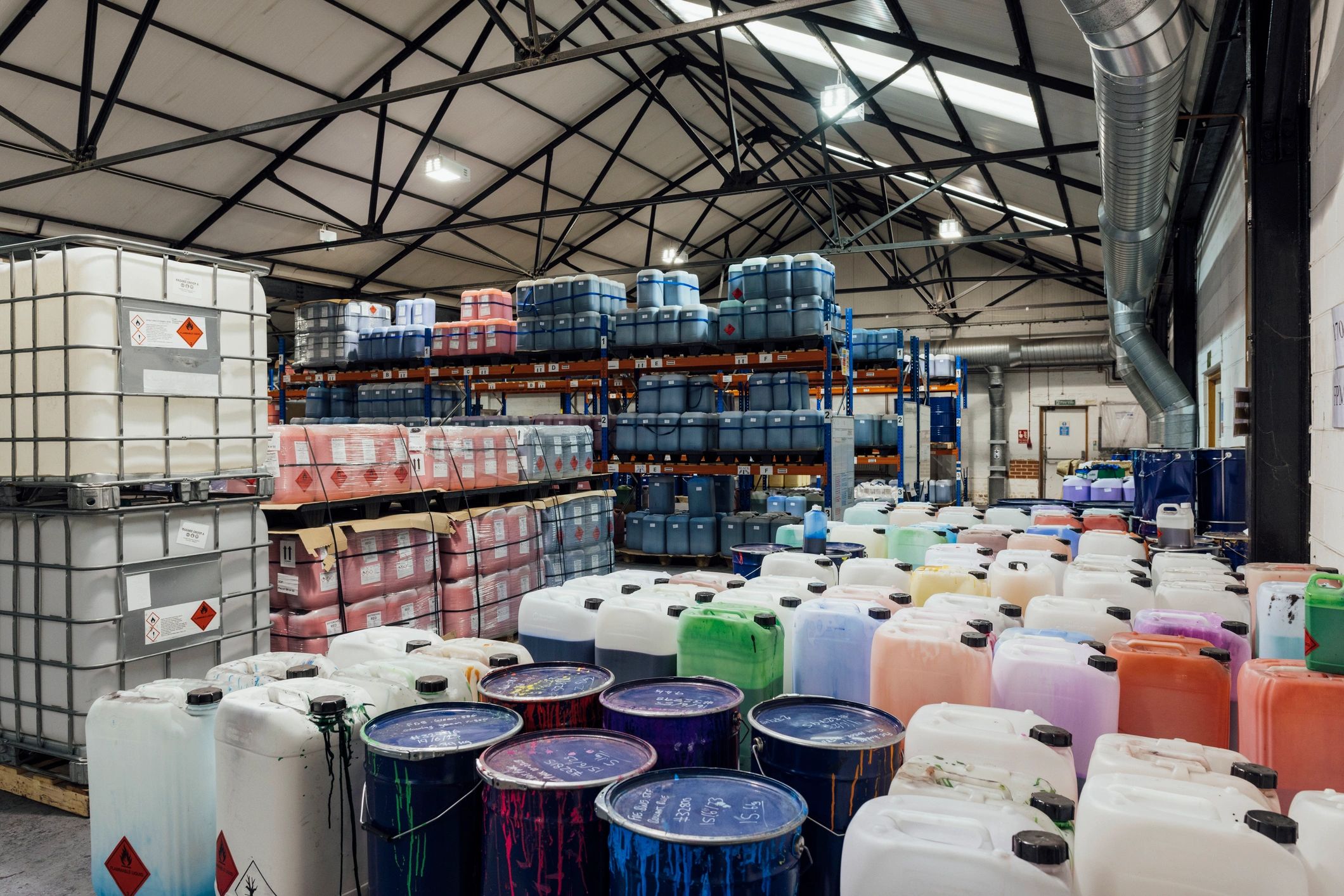Warehouse containers and drums prepared for shipment