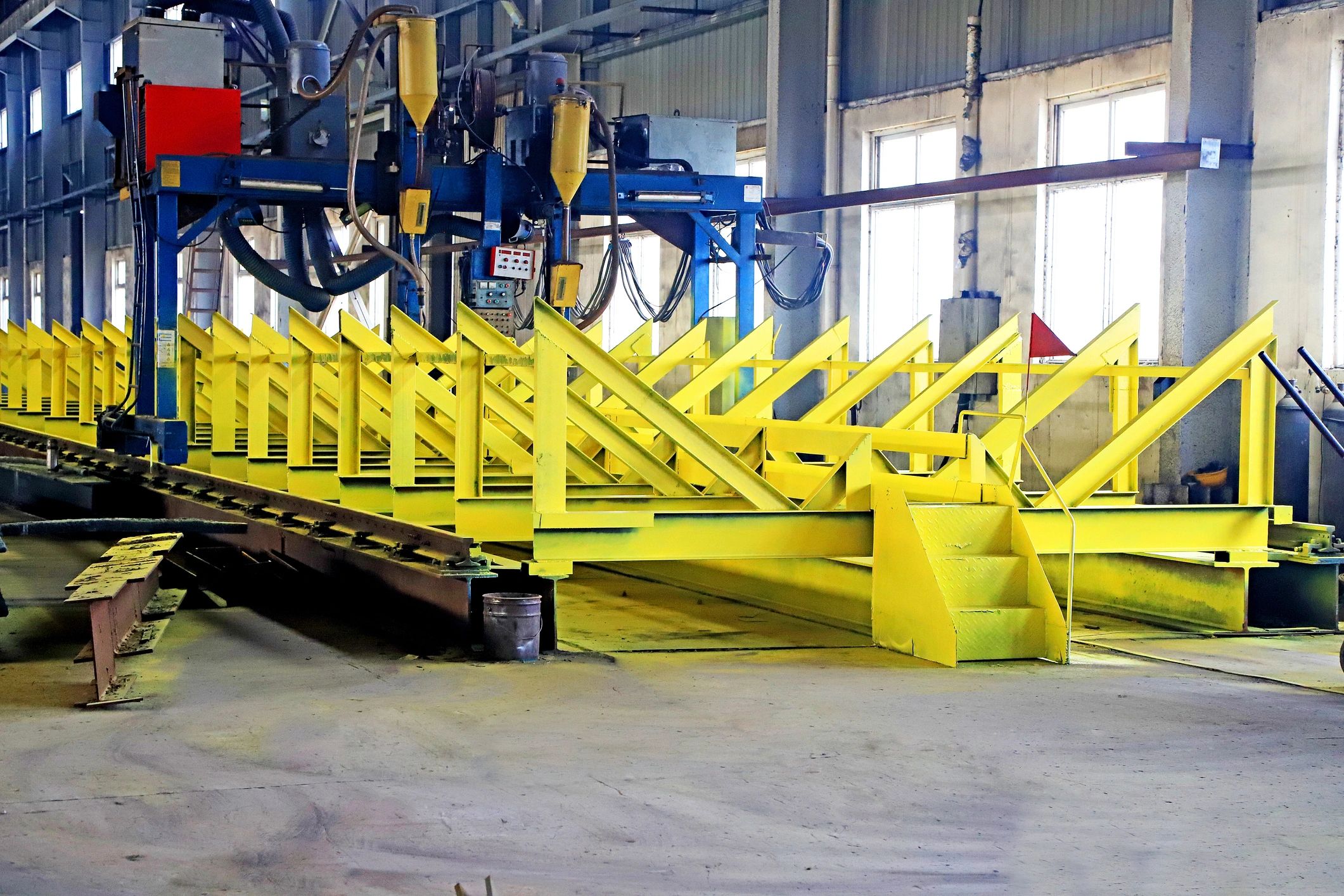 Automated industrial line showing metal coating applications